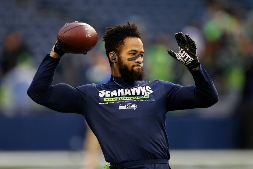 FILE - In this Nov. 20, 2017 file photo, Seahawks safety Earl Thomas warms up before a game...