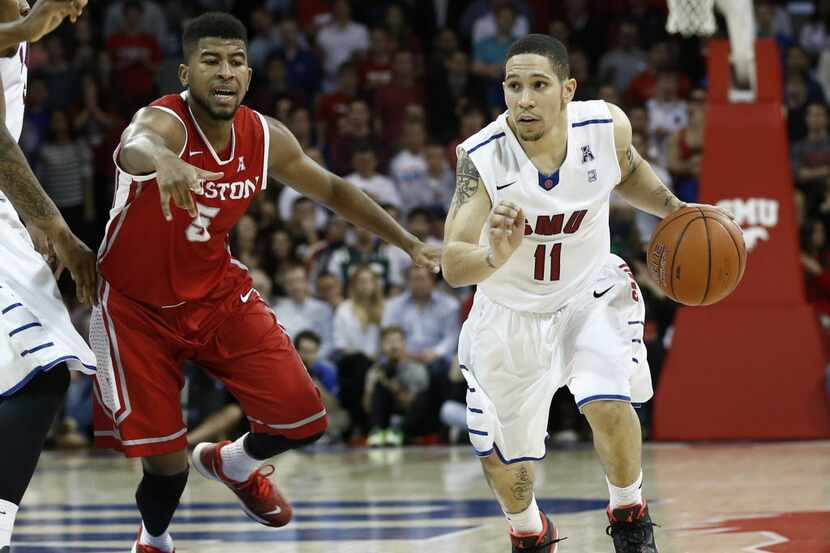 Feb 19, 2014; Dallas, TX, USA; Southern Methodist Mustangs guard Nic Moore (11) moves the...