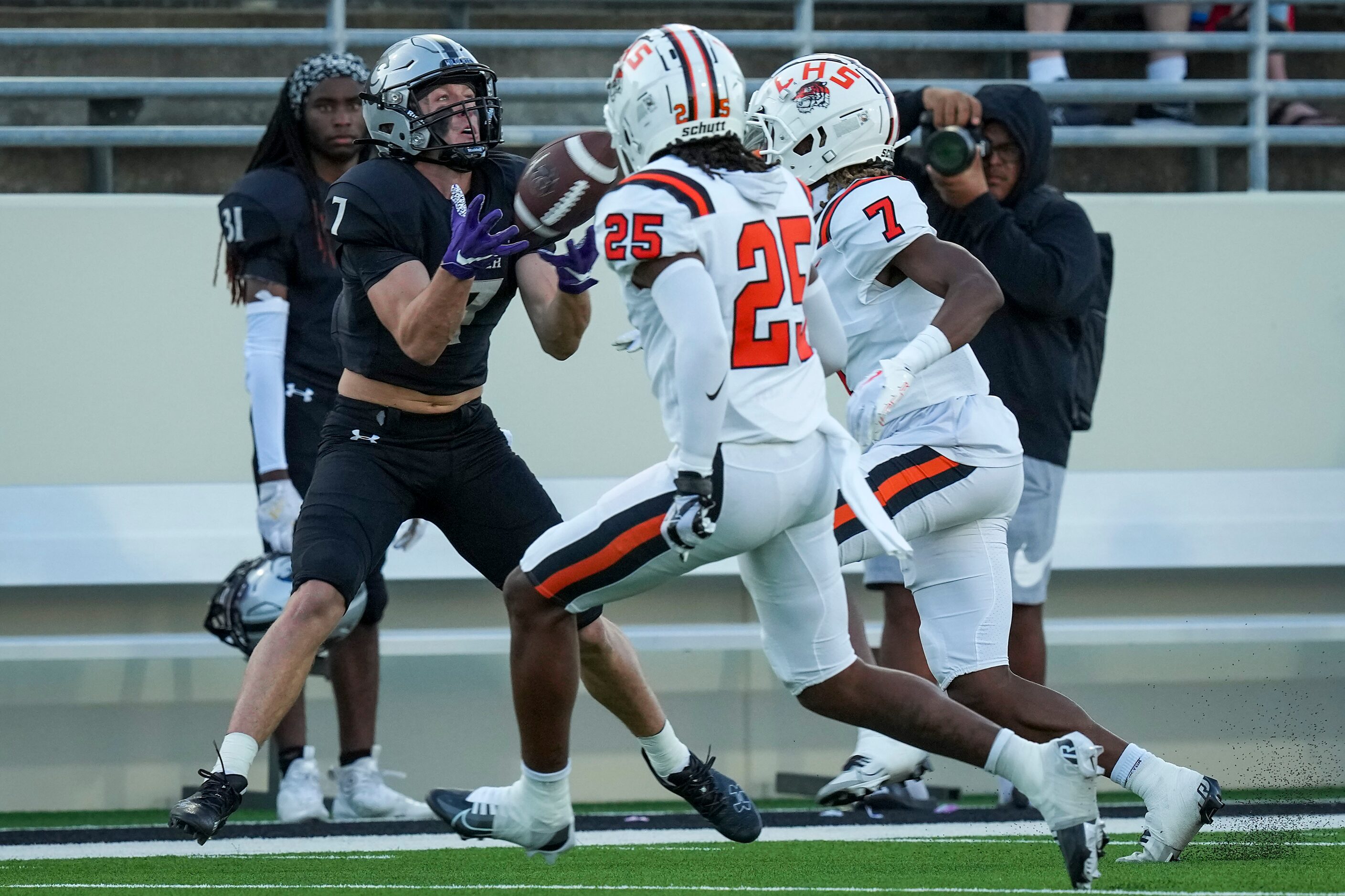 Denton Guyer wide receiver Landon Sides (7) makes a catch as Lancaster defensive back...