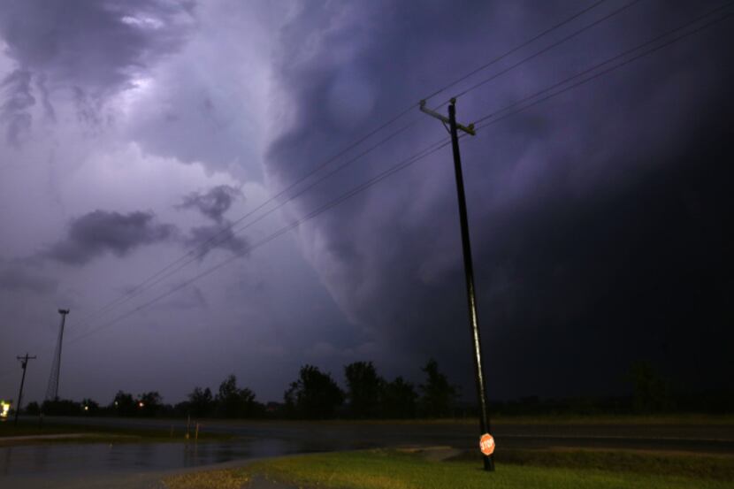 The backside of the tornado-producing storm barrels past State Highway 67 west of Cleburne...