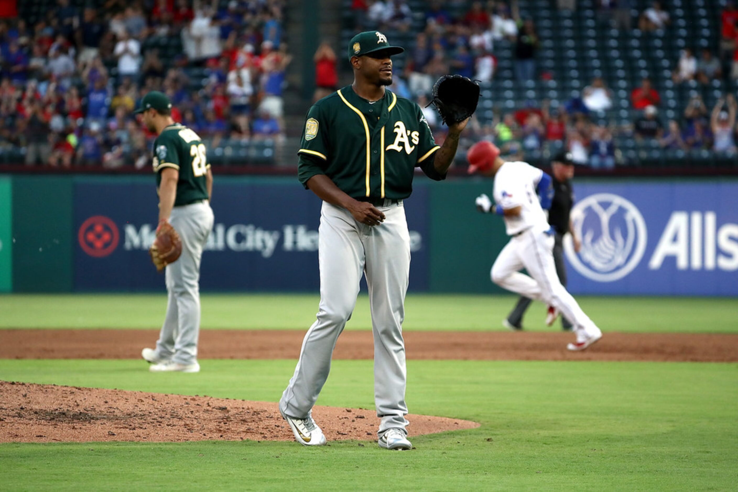 ARLINGTON, TX - JULY 25:  Edwin Jackson #37 of the Oakland Athletics steps off the mound...