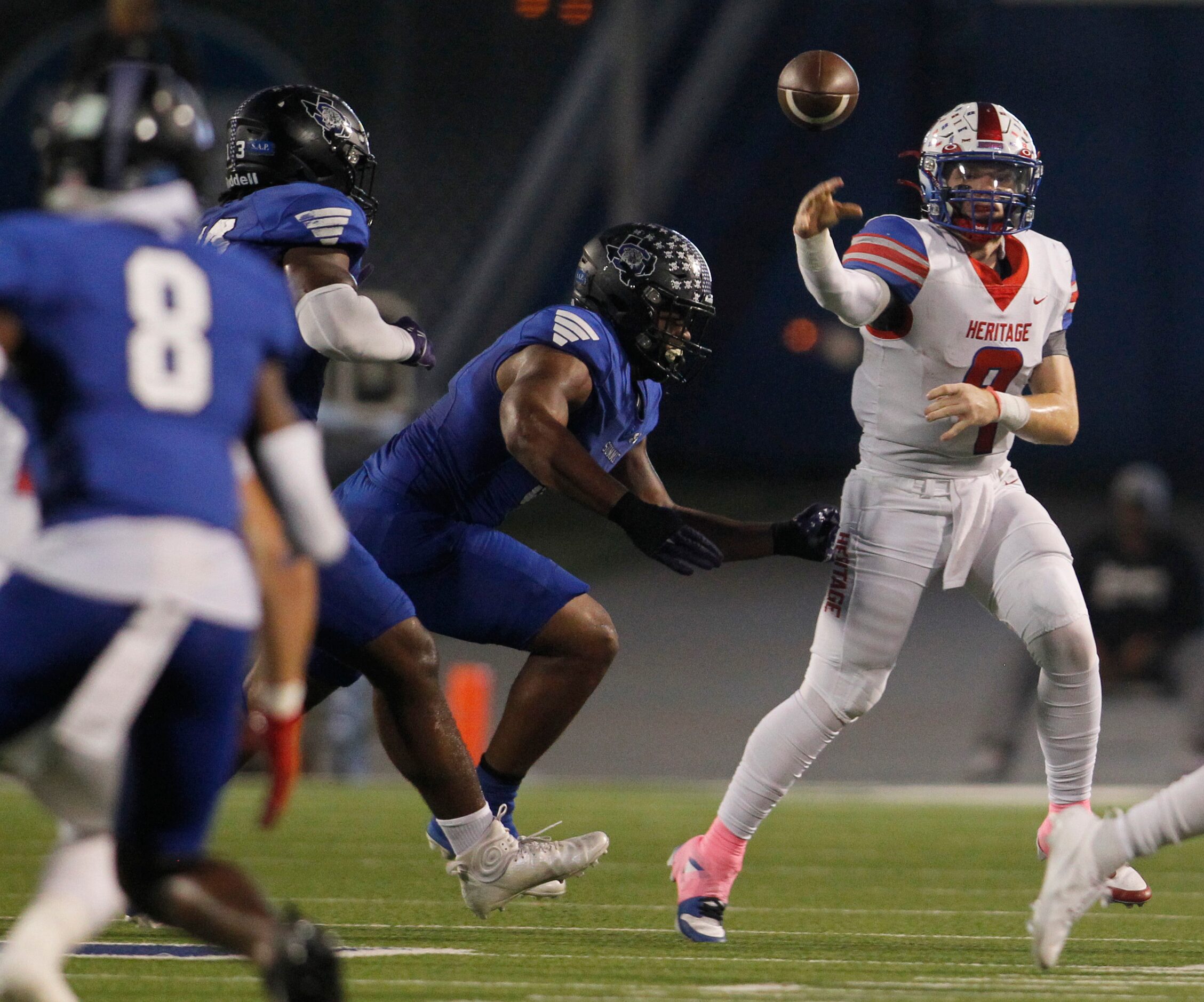 Midlothian Heritage quarterback Carter Rutenbar (9) launches a pass as Mansfield Summit...