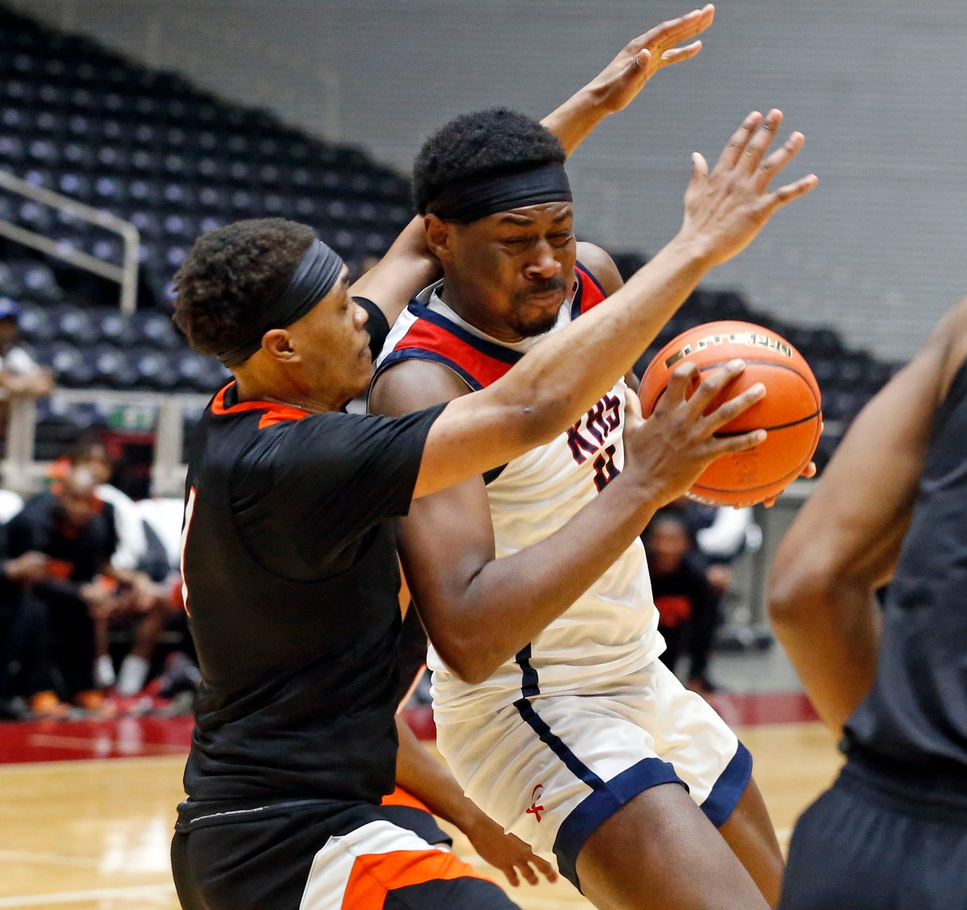 Lancaster High's Deontrell Barett (1) pressures Kimball High’s DaCannon Wickware (4) during...