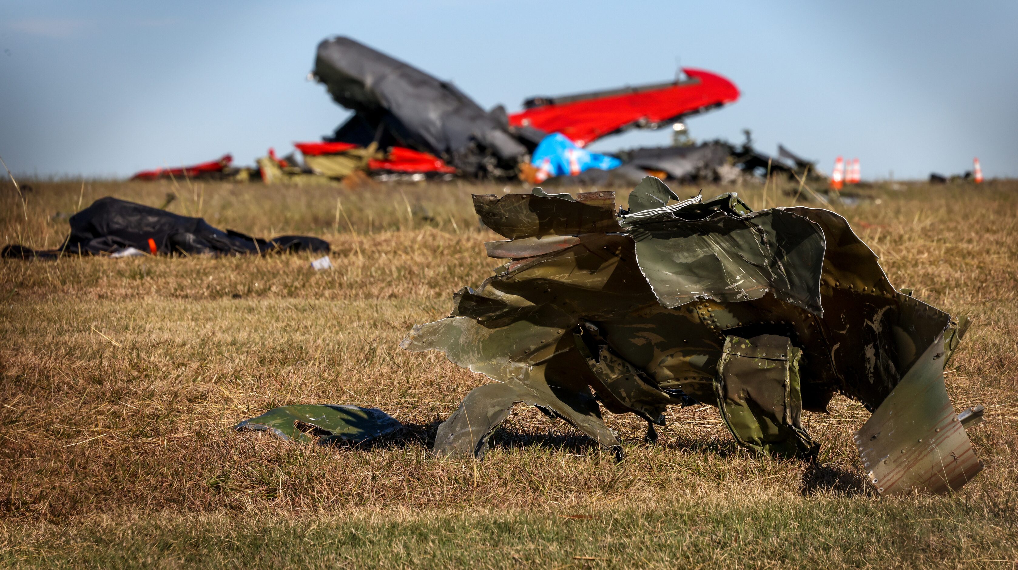 Debris lays across the open field at the Dallas Executive Airport on Sunday, Nov. 13, 2022,...