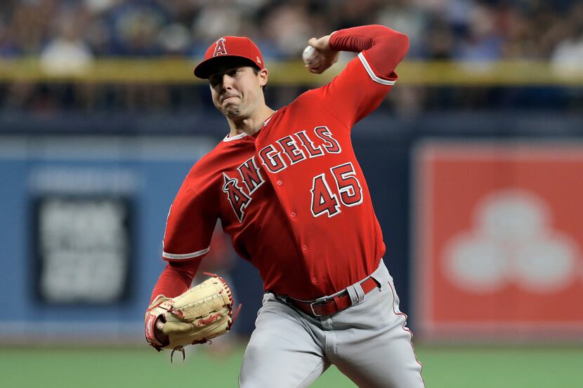 FILE - In this June 13, 2019 file photo Los Angeles Angels' Tyler Skaggs pitches to the...