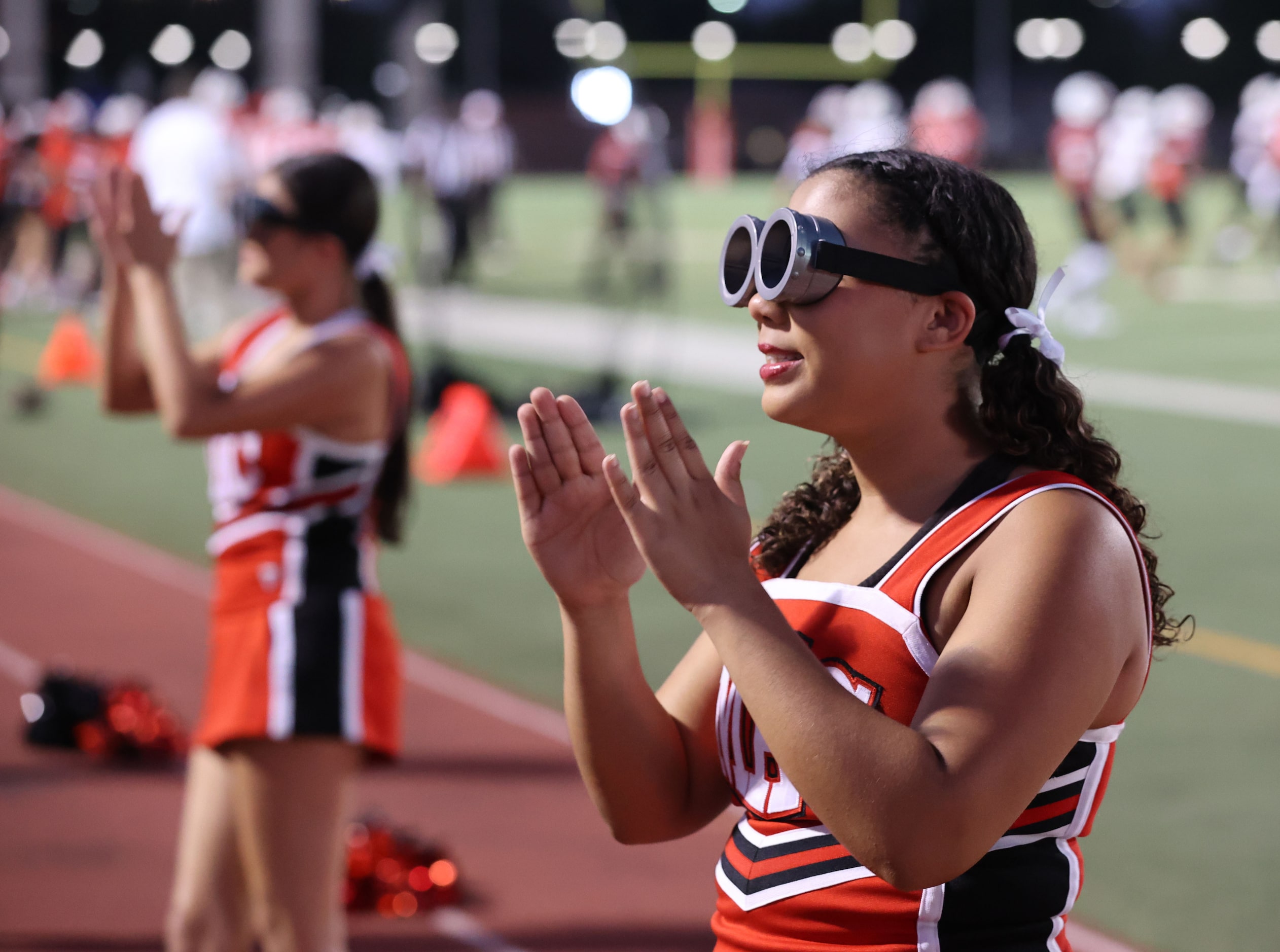 Irving MacArthur High cheerleaders sport minion-goggles during a spirit routine in the first...