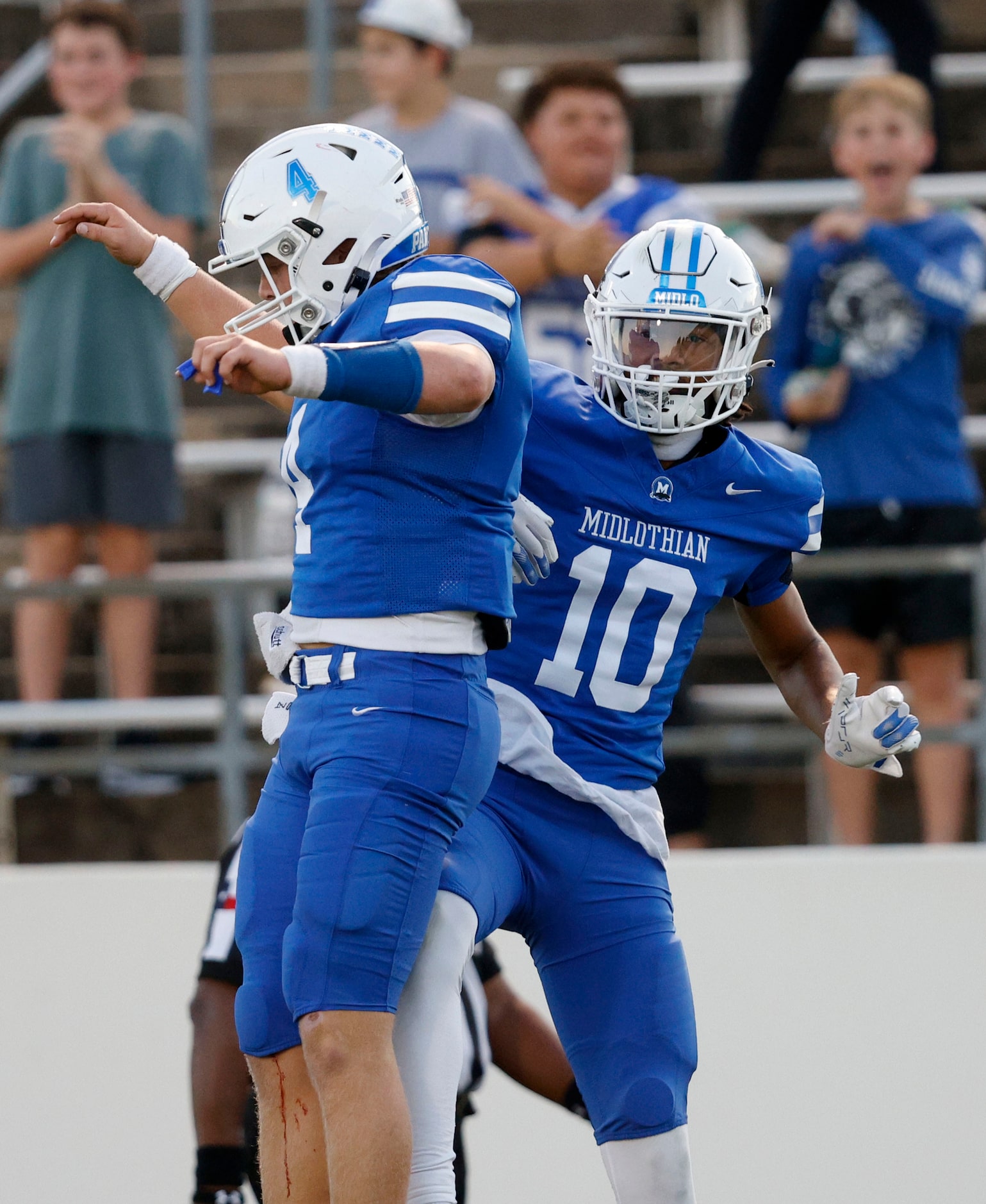 Midlothian's quarterback Beau Wendel (4) celebrates his touchdown pass to Brendyn Jackson...