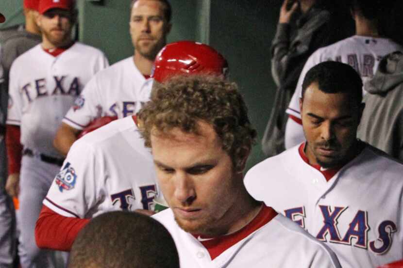 The Texas Ranger take the field to stretch before batting practice during Media Day...