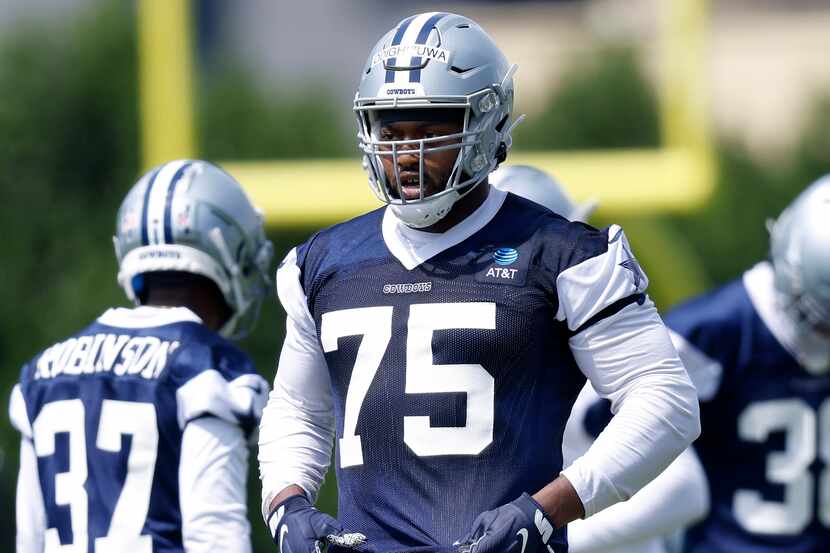 Dallas Cowboys rookie defensive tackle Osa Odighizuwa (75) waits to run another play during...
