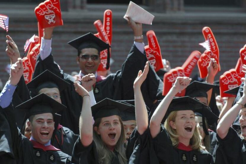 
Harvard Business School students cheer as their MBA degrees are conferred.
