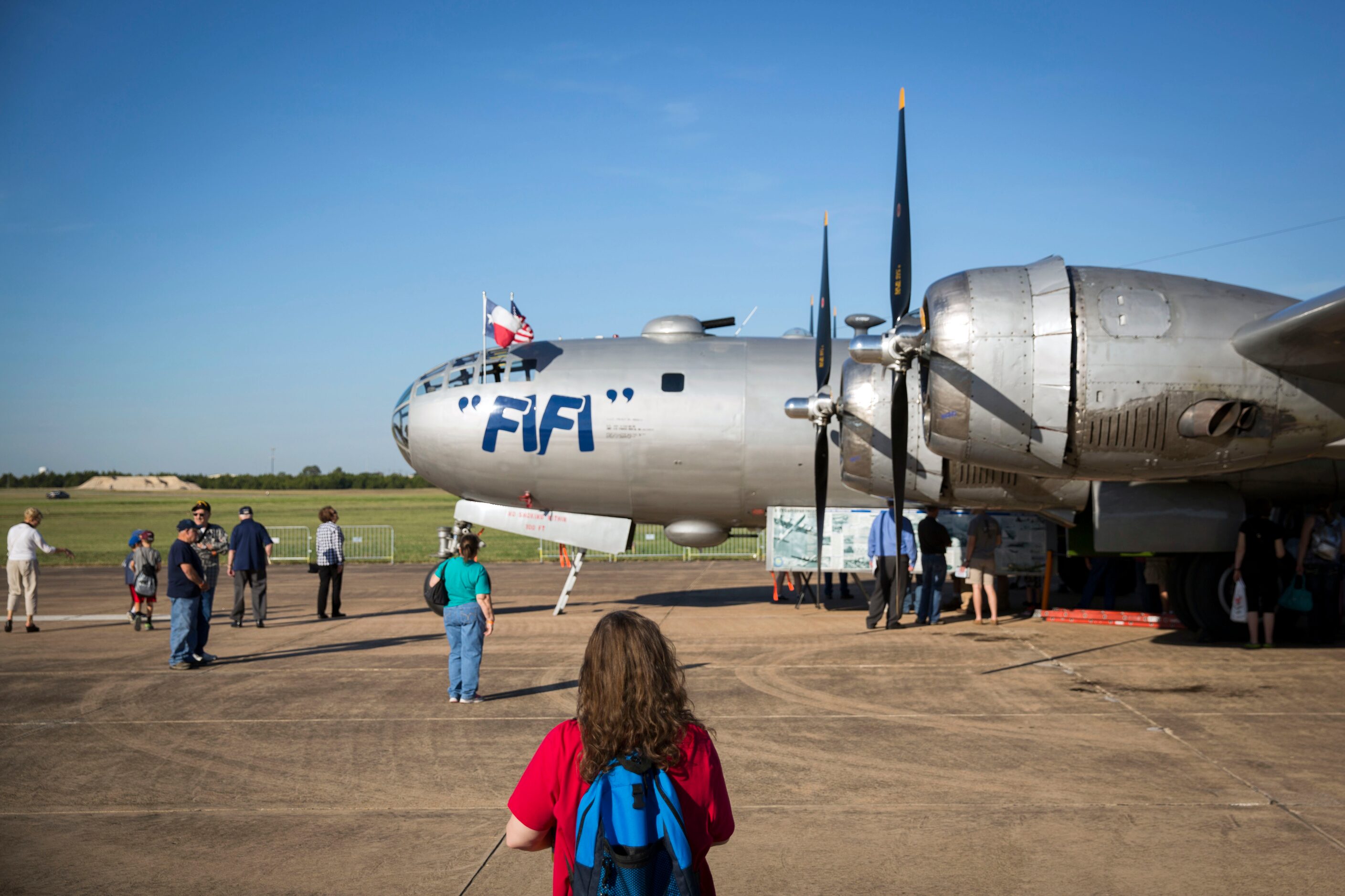 People gather to look at "FIFI," a B-29 Superfortress, during the Commemorative Air Force...