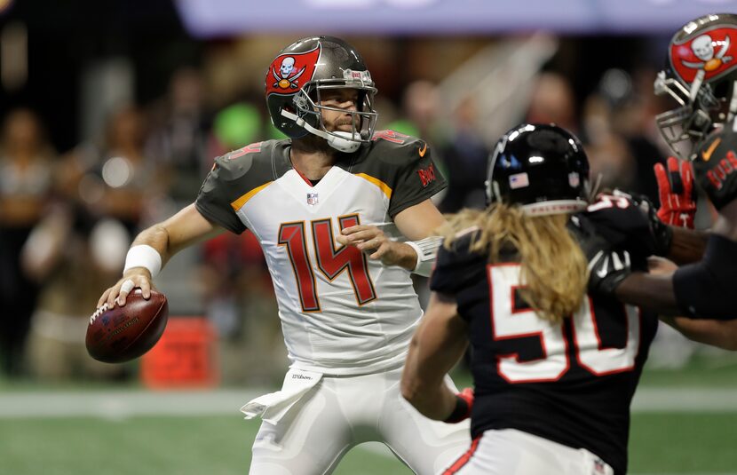 FILE - Tampa Bay Buccaneers quarterback Ryan Fitzpatrick (14) works against the Atlanta...