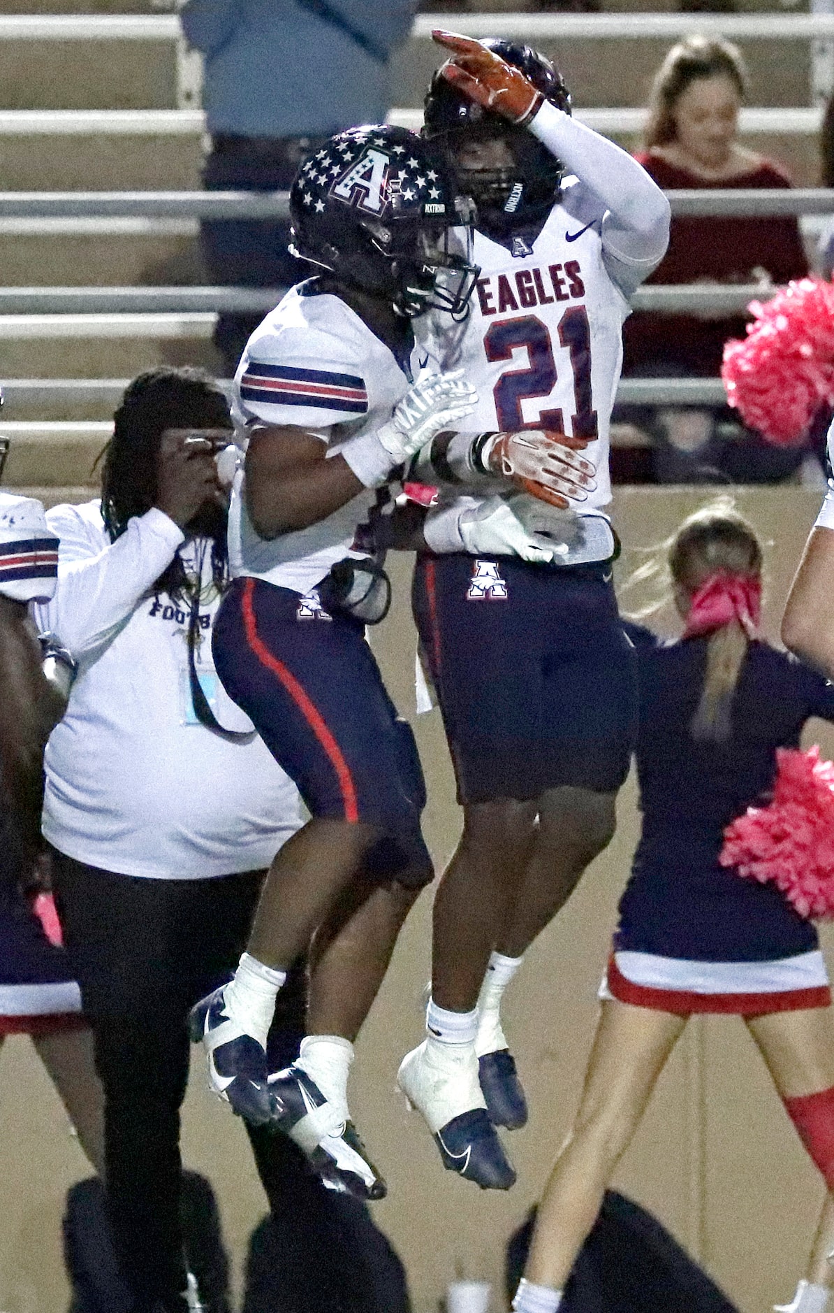 Allen High School running back Lyndon Spriggs (11) celebrates his touchdown run by leaping...