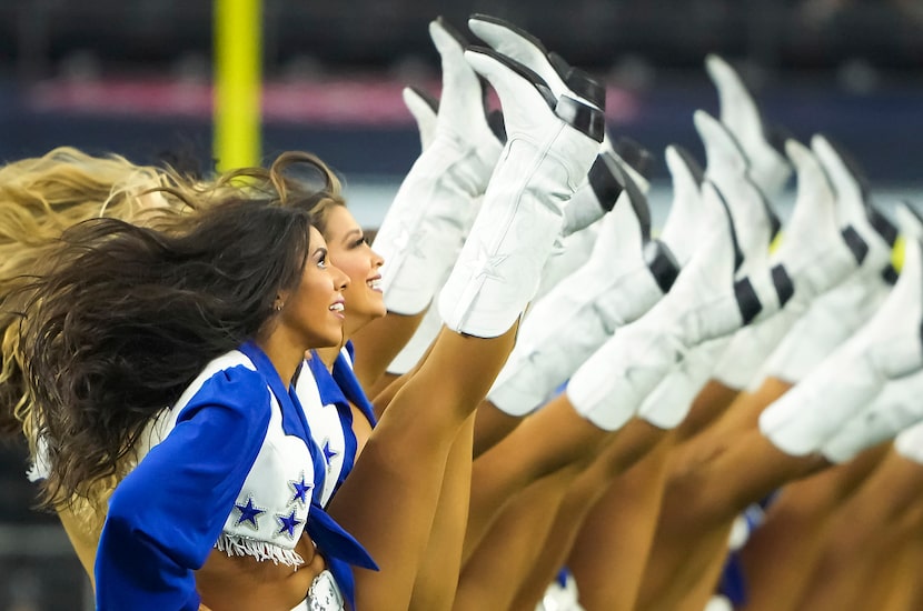 The Dallas Cowboys cheerleaders high-kicked during a performance at the preseason game...