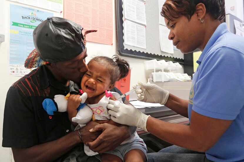 
Two-year-old Lauryn Hoye received a hepatitis A vaccination from licensed vocational nurse...