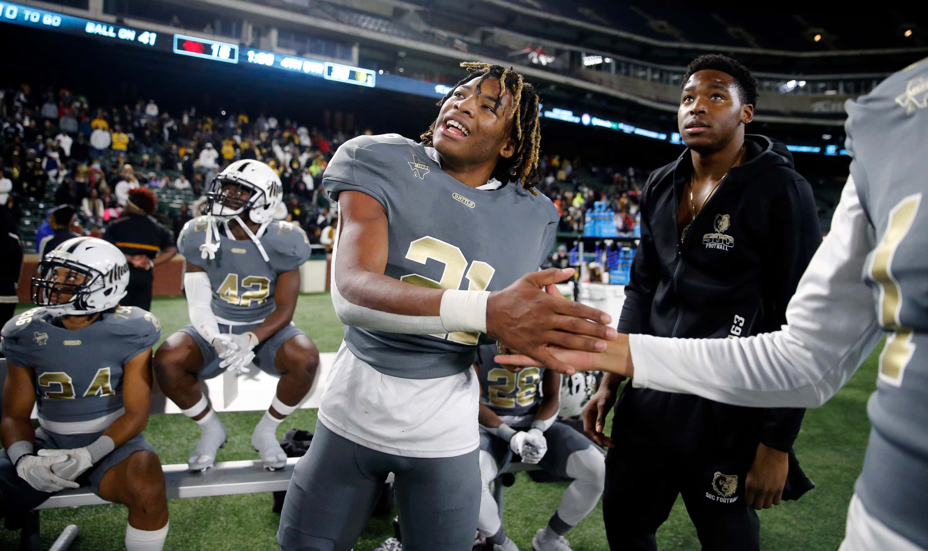 South Oak Cliff running back Danny Green (21) is congratulated on the win as the team...