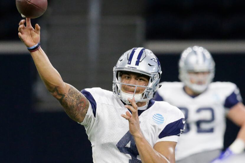 Dallas Cowboys quarterback Dak Prescott (4) passes during an indoor NFL football practice at...