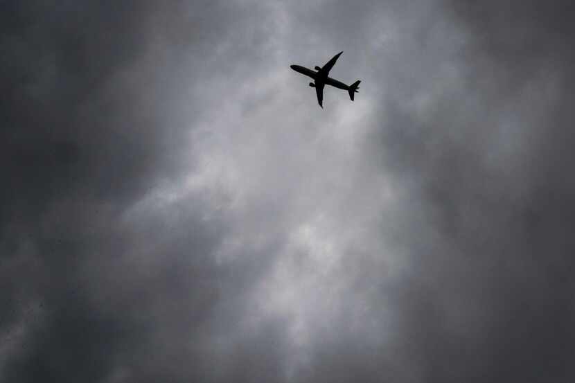 Storm clouds over aircraft on approach to Dallas-Fort Worth International Airport on Monday,...