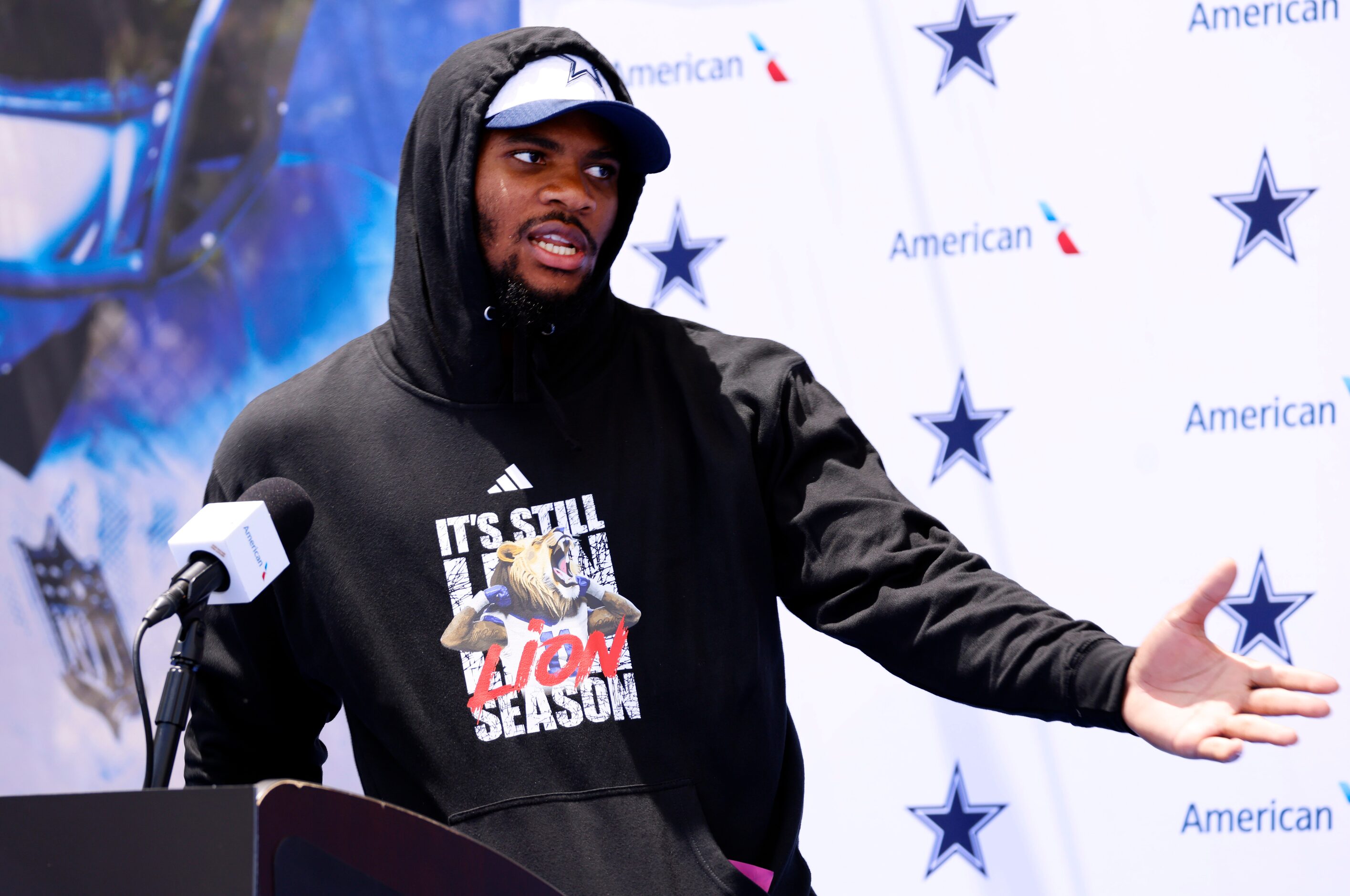 Animated Dallas Cowboys linebacker Micah Parsons talks to the media during a post training...