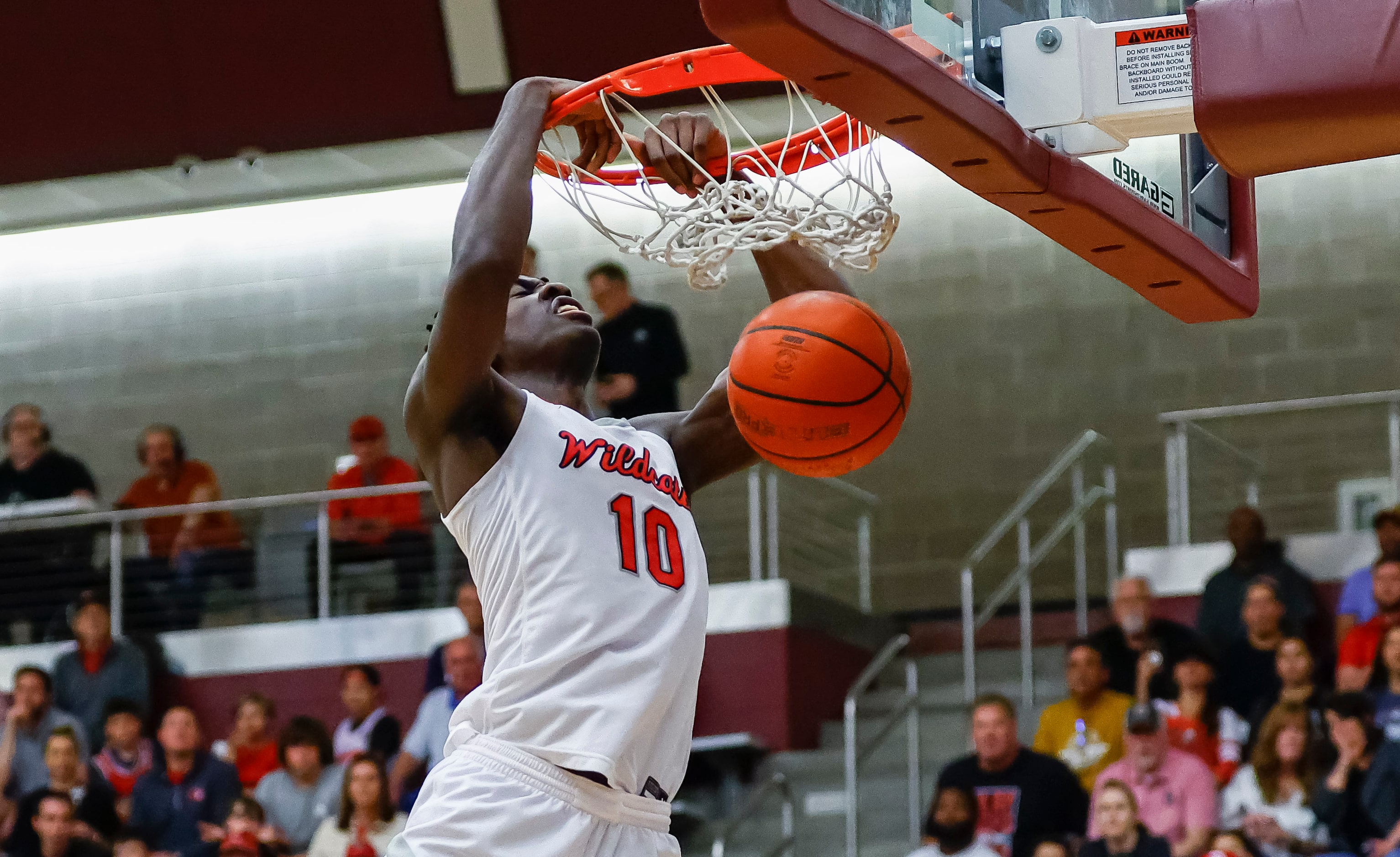 Lake Highlands senior forward Samson Aletan dunks during a Class 6A bi-district playoff game...