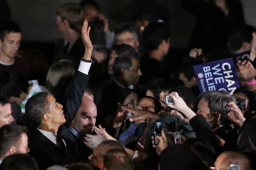  Barack Obama waves to the crowd of supporters at the Municipal Auditorium during the Texas...
