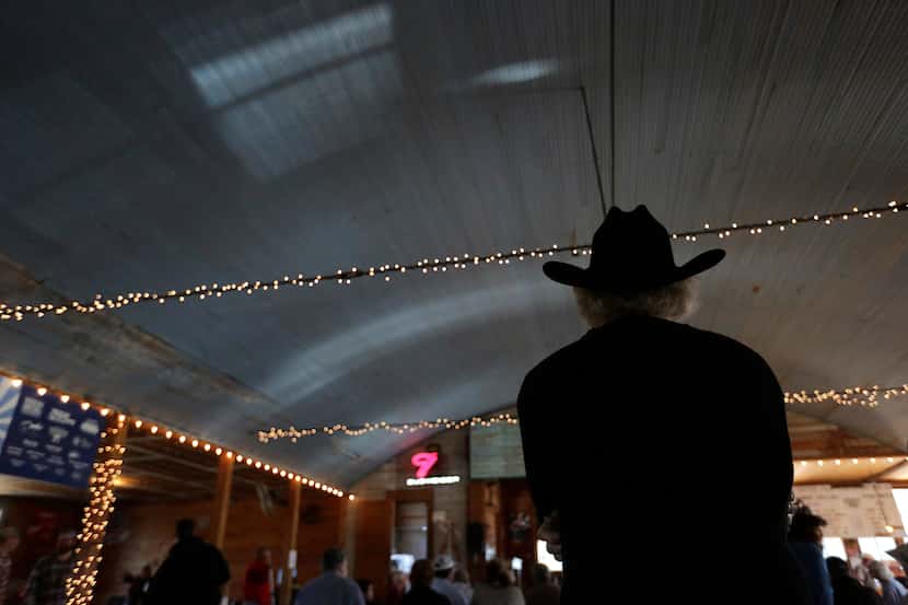 In this Dec. 6, 2014, photo, visitors listen during a fiddle festival at Twin Sisters Dance...