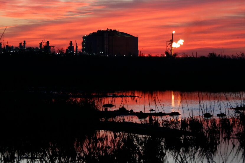 FILE - A flare burns at Venture Global LNG in Cameron, La., on April 21, 2022. Most major...