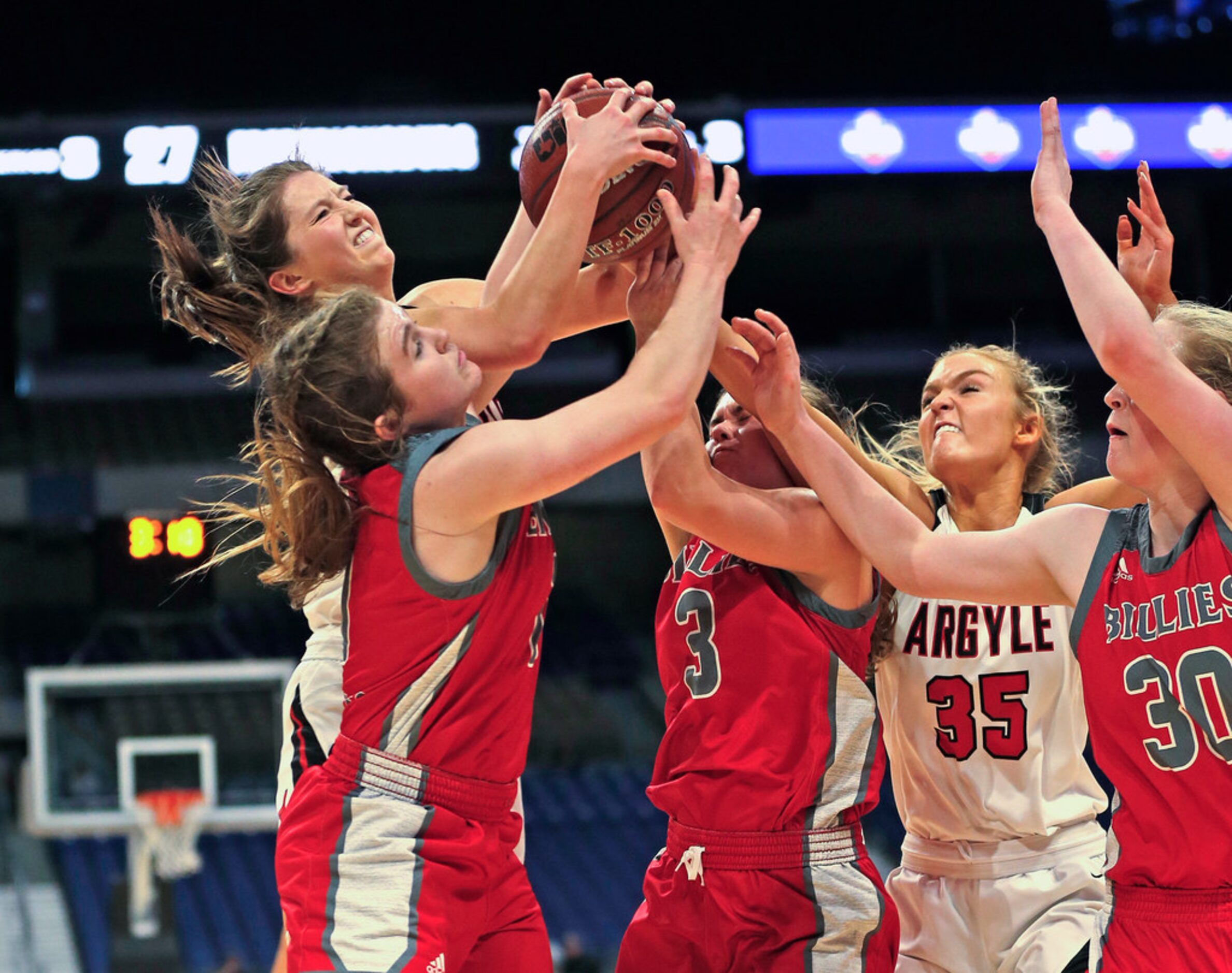 Argyle guard Bailey Timmons #4 battles Fredericksburg guard Brittley Bowers #11 for a...