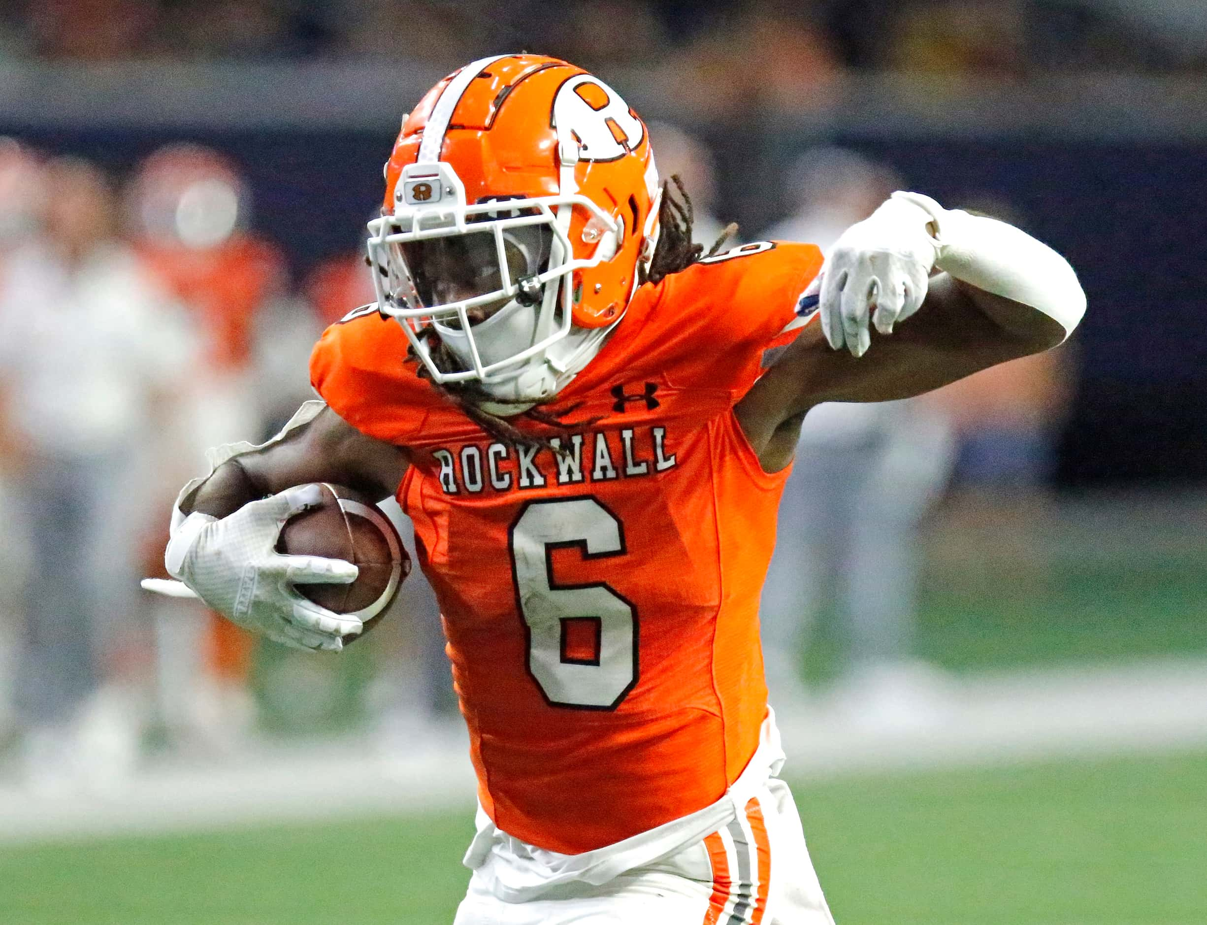 Rockwall High School running back Ashten Emory (6) attempts to run after a catch near the...