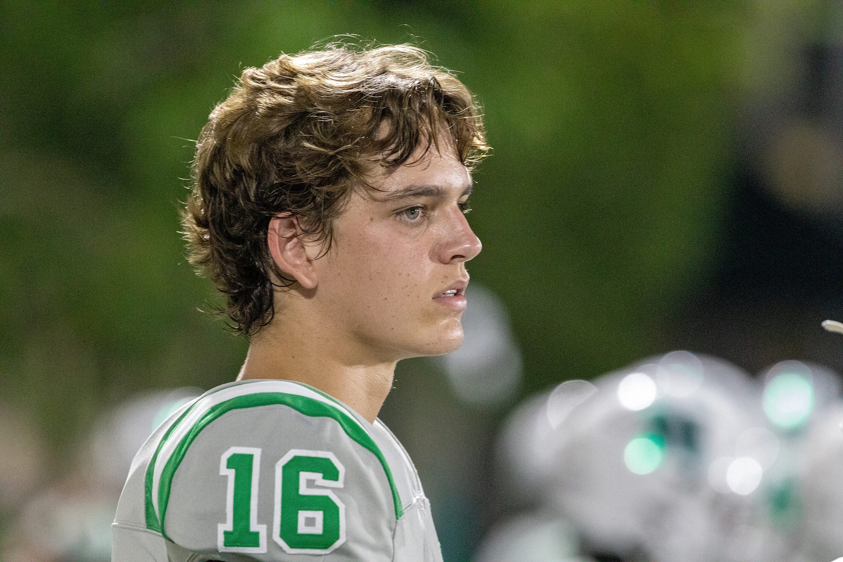 Arch Manning watches the action from the sidelines as Newman High School takes on Riverside...