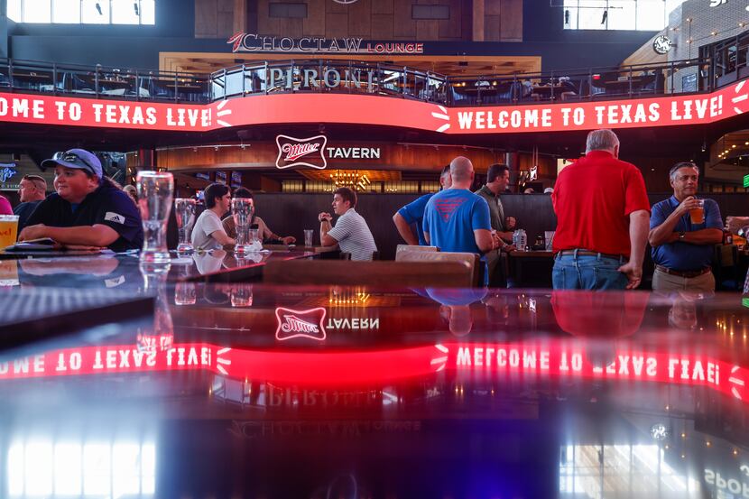 People gather at Texas Live! in Arlington, a major entertainment venue, on Wednesday....