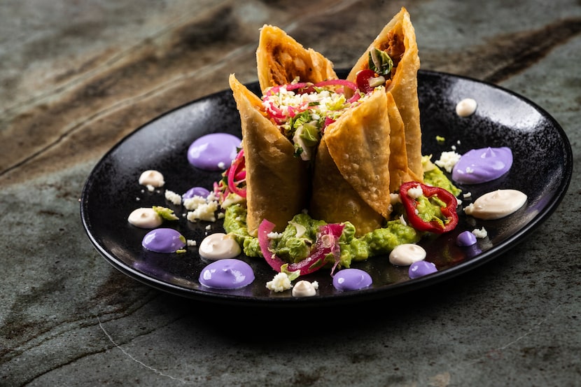 The lavendar orbs near La Neta's flautas are crema, dyed purple from eggplant puree, to give...