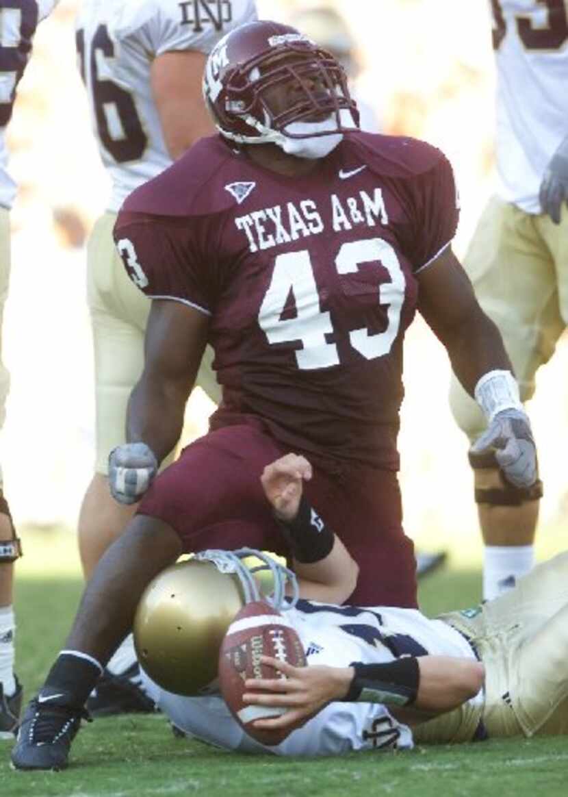 ORG XMIT: S160A1888 Texas A&M's Jarrod Penright celebrates as he climbs off Notre Dame...