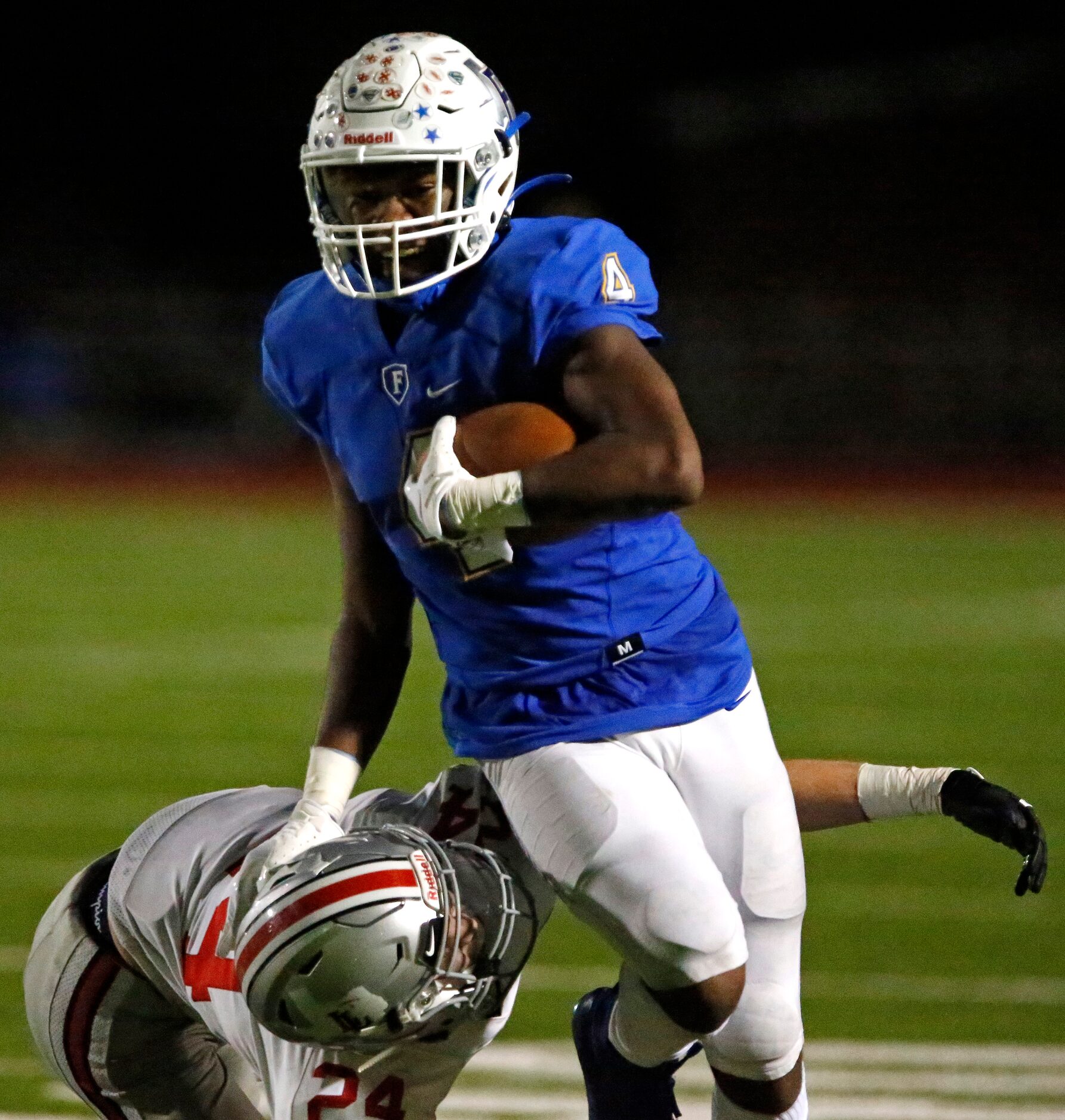 Frisco High School wide receiver Chase Lowery (4) is tackled by Lovejoy High School...