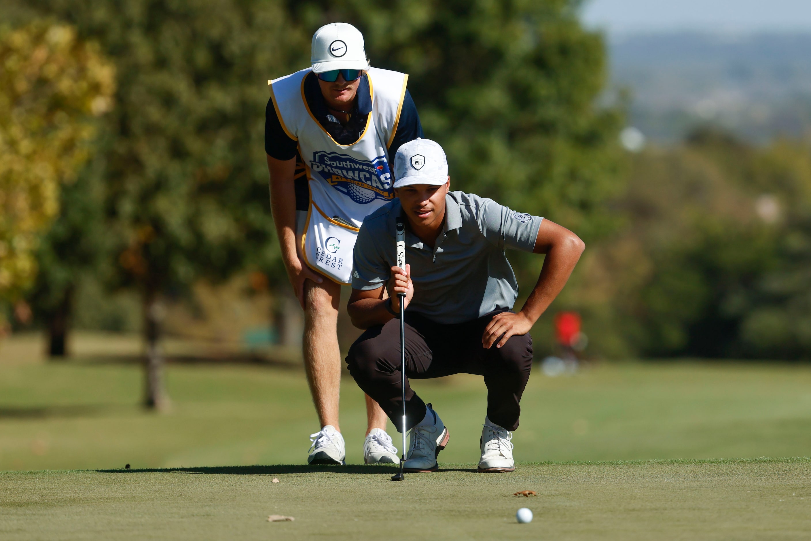 Xavier Bighaus of Colorado Christian University who grew up in Melissa, lines up his putt in...