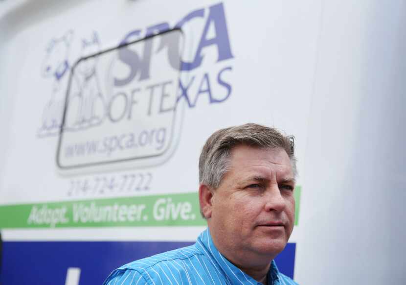 James Bias, SPCA of Texas president James Bias speaks with an employee at the nonprofit's...
