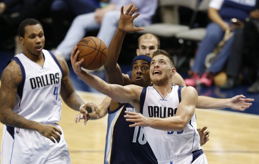 Dallas Mavericks guard Gal Mekel (33) attempts a shot in front of Memphis Grizzlies center...