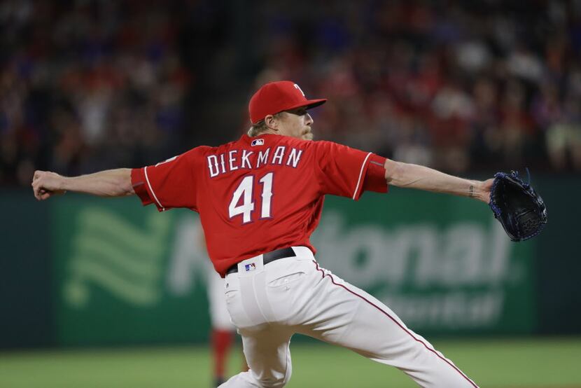 ARLINGTON, TX - SEPTEMBER 30:  Jake Diekman #41 of the Texas Rangers throws against the...
