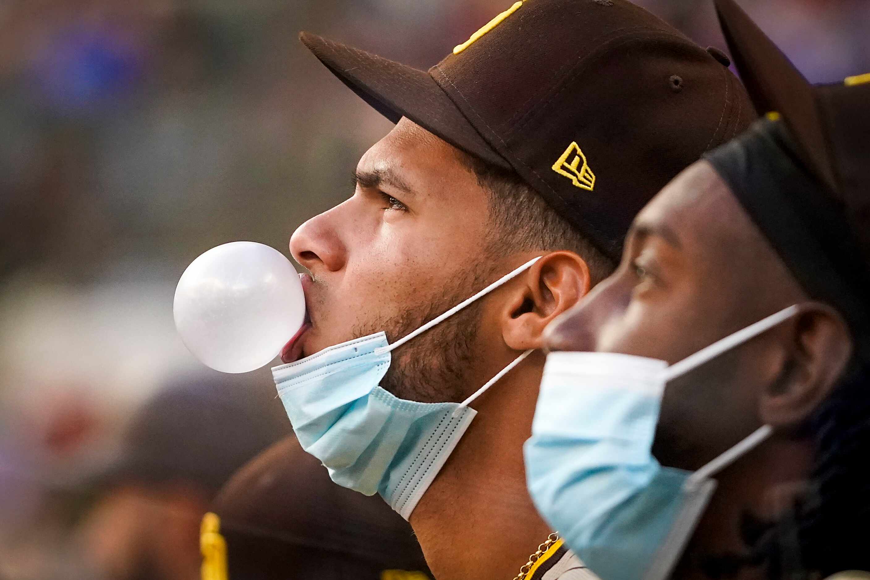 San Diego Padres second baseman Tucupita Marcano blows bubbles in the dugout during the...