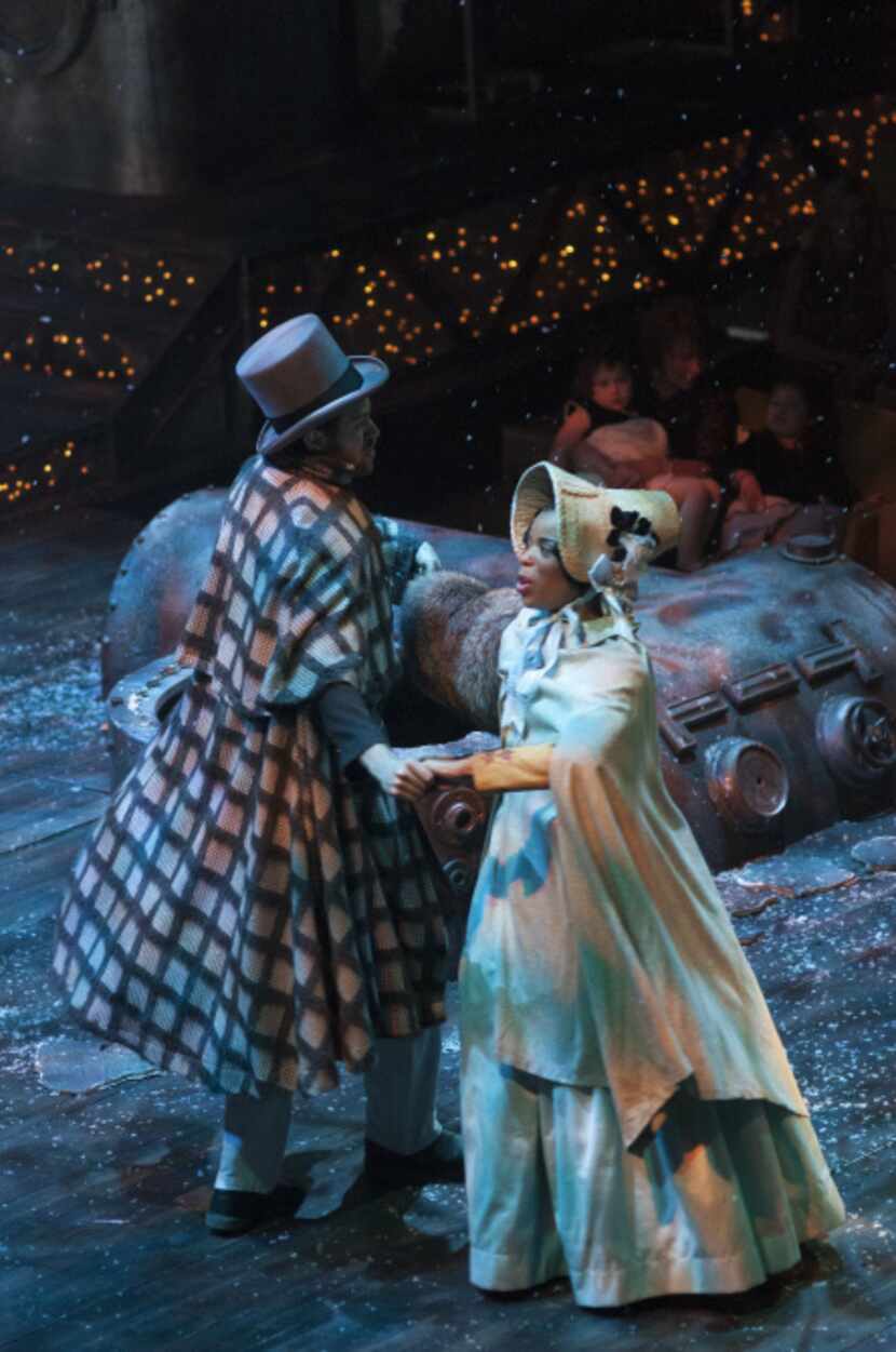Alex Organ (young Scrooge), Tiffany Hobbs (Lucy), perform in Kevin Moriarty's adaptation of...