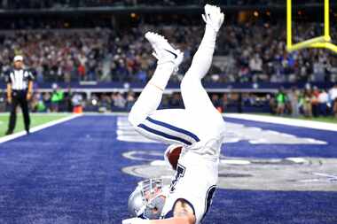 Dallas Cowboys wide receiver Ryan Switzer  dives into the end zone after returning a...
