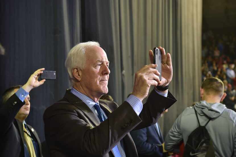 Sen. John Cornyn, R-Texas, takes a picture during President Donald Trump's rally in El Paso...