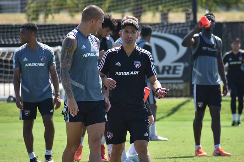 FC Dallas Head Coach Luchi Gonzalez (all black) talks to Zdenek Ondrasek after training....