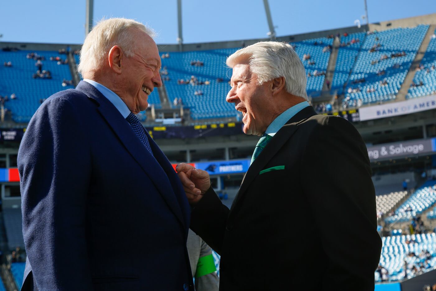Dallas Cowboys owner Jerry Jones chats with Pro Football Hall of Fame coach Jimmy Johnson...