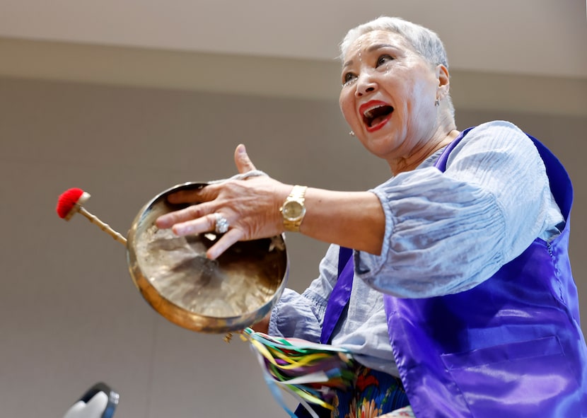 Arirang Texas Group member Kyong Cooper plays a kkwaenggwari as she practices samulnori at...