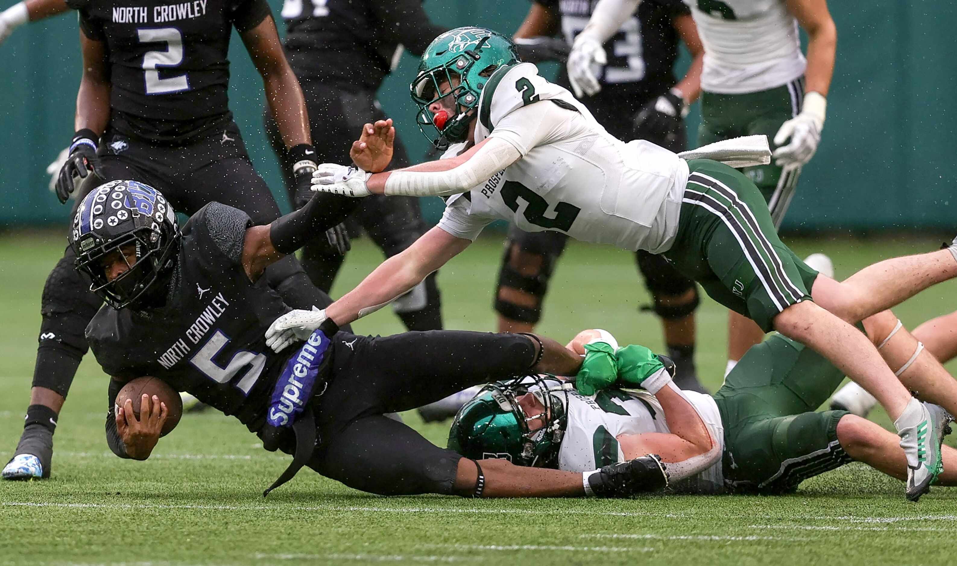 North Crowley running back Dejuan Lacy (5) is dragged down by Prosper linebacker Jonah...