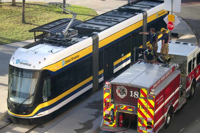 Dallas firefighters climbed on top of their truck to talk about a small electrical fire that...