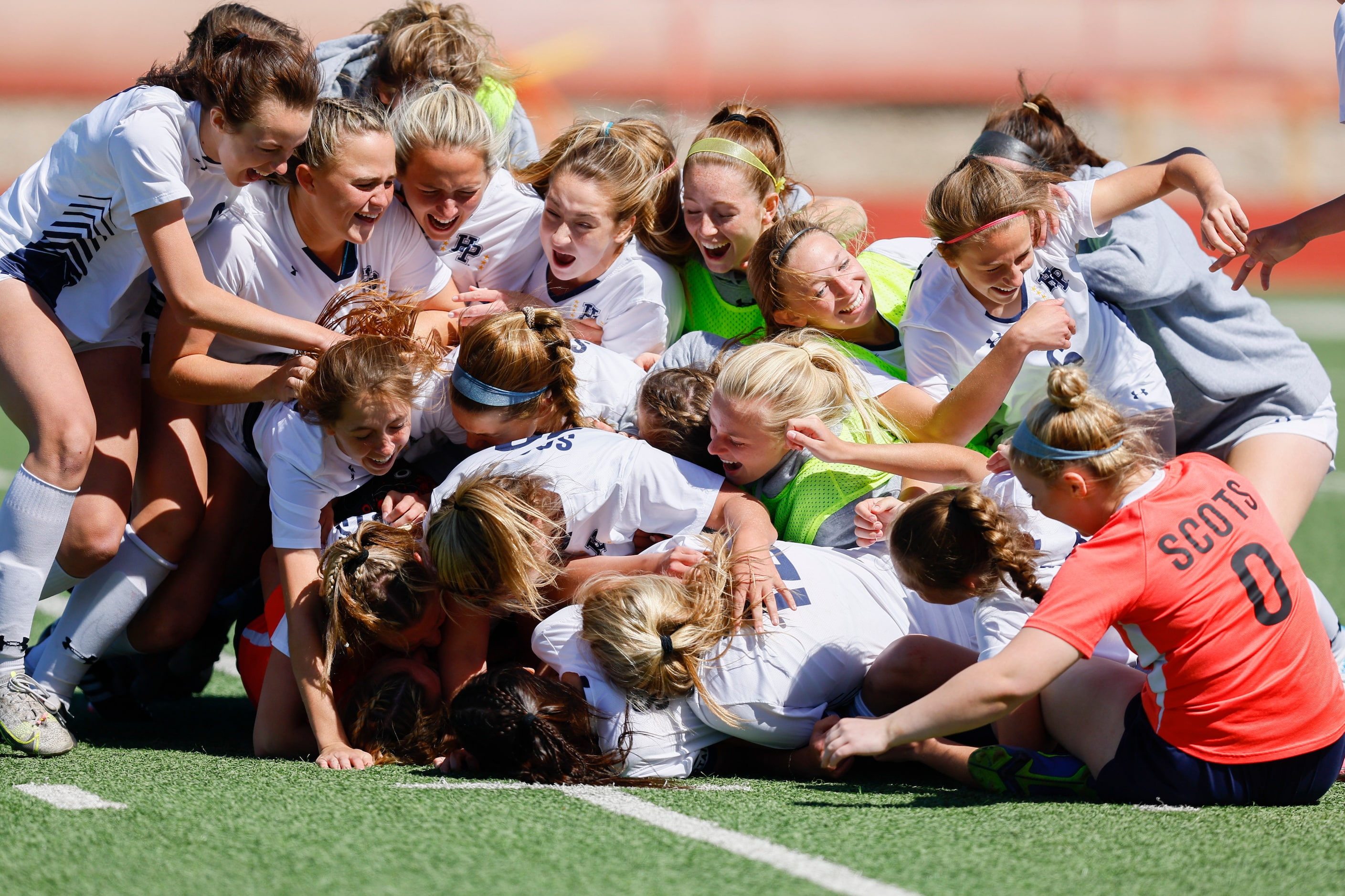 Highland Park celebrates the game winning sudden death goal, scored by Parker Buckroyd,...