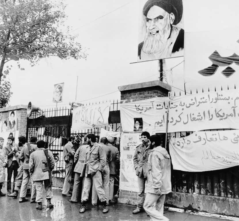 In this Nov. 6, 1979 file photo, students stand guard before the entrance of the United...