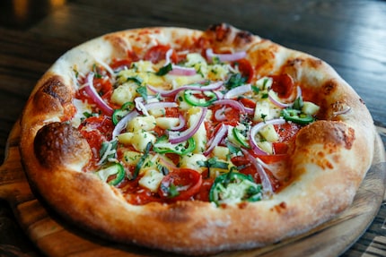 Menu items at Bottled Blonde include Hawaiian pizza.